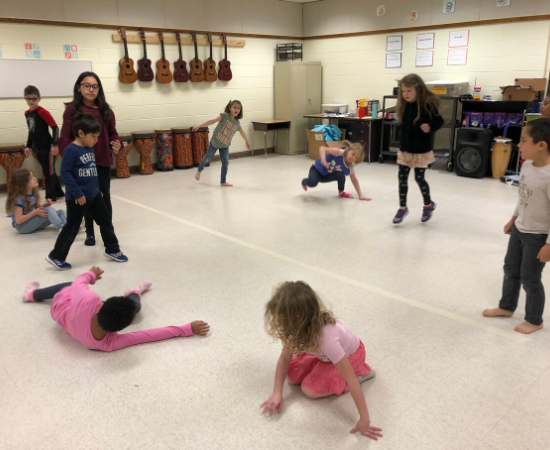 A group of young dancers exploring movement