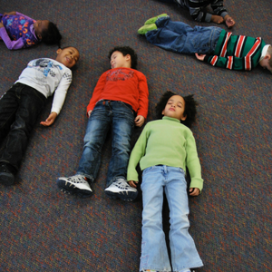 a group of students lay on their backs